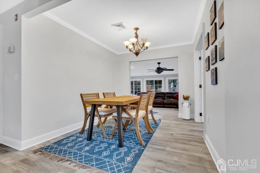 17 Whitney Drive Middlesex, NJ 08846 - Photo 9 of 18 a view of a dining room with furniture and wooden floor