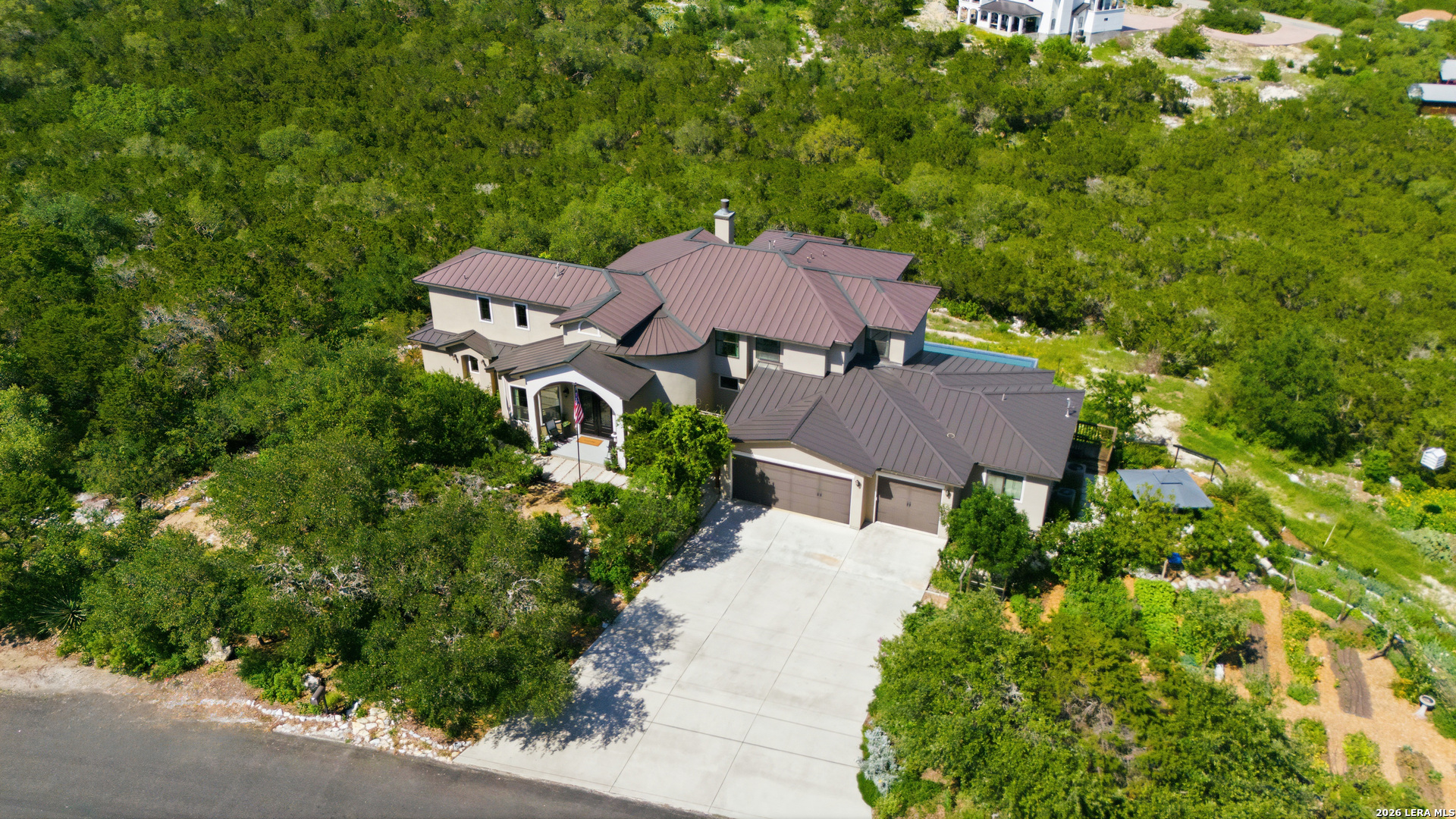 10042 Rafter S Trail Helotes, TX 78023 - Photo 2 of 69 an aerial view of a house with yard and outdoor seating