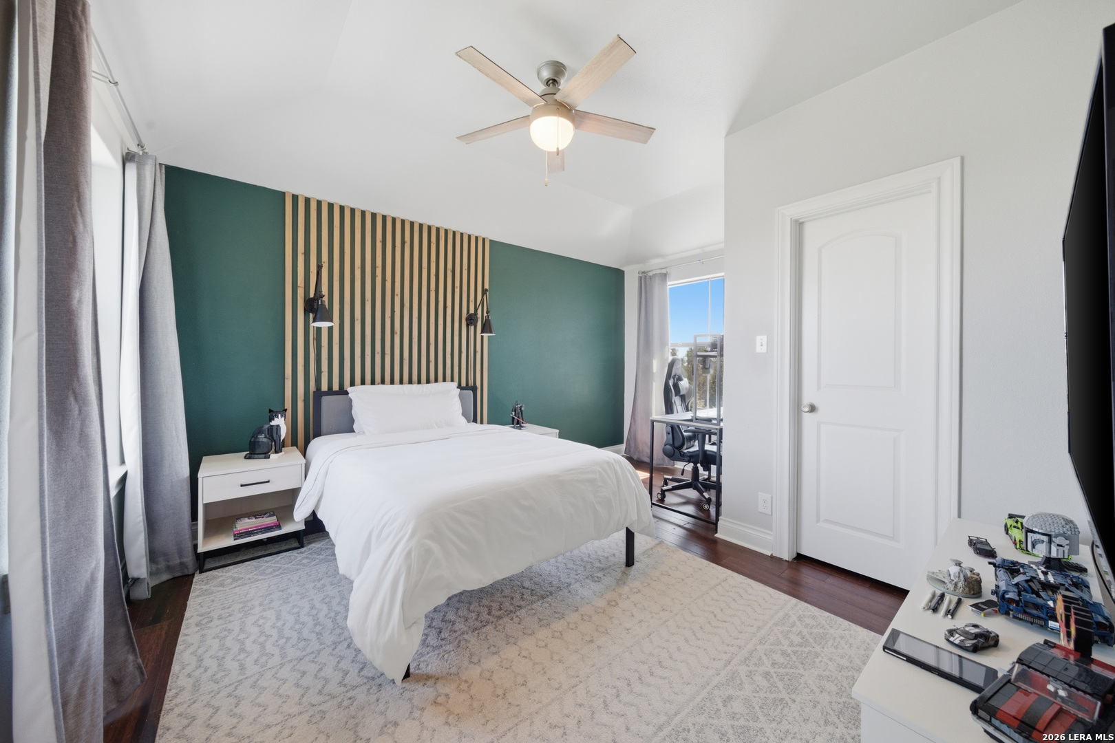 10042 Rafter S Trail Helotes, TX 78023 - Photo 39 of 69 a bedroom with a bed and a chandelier