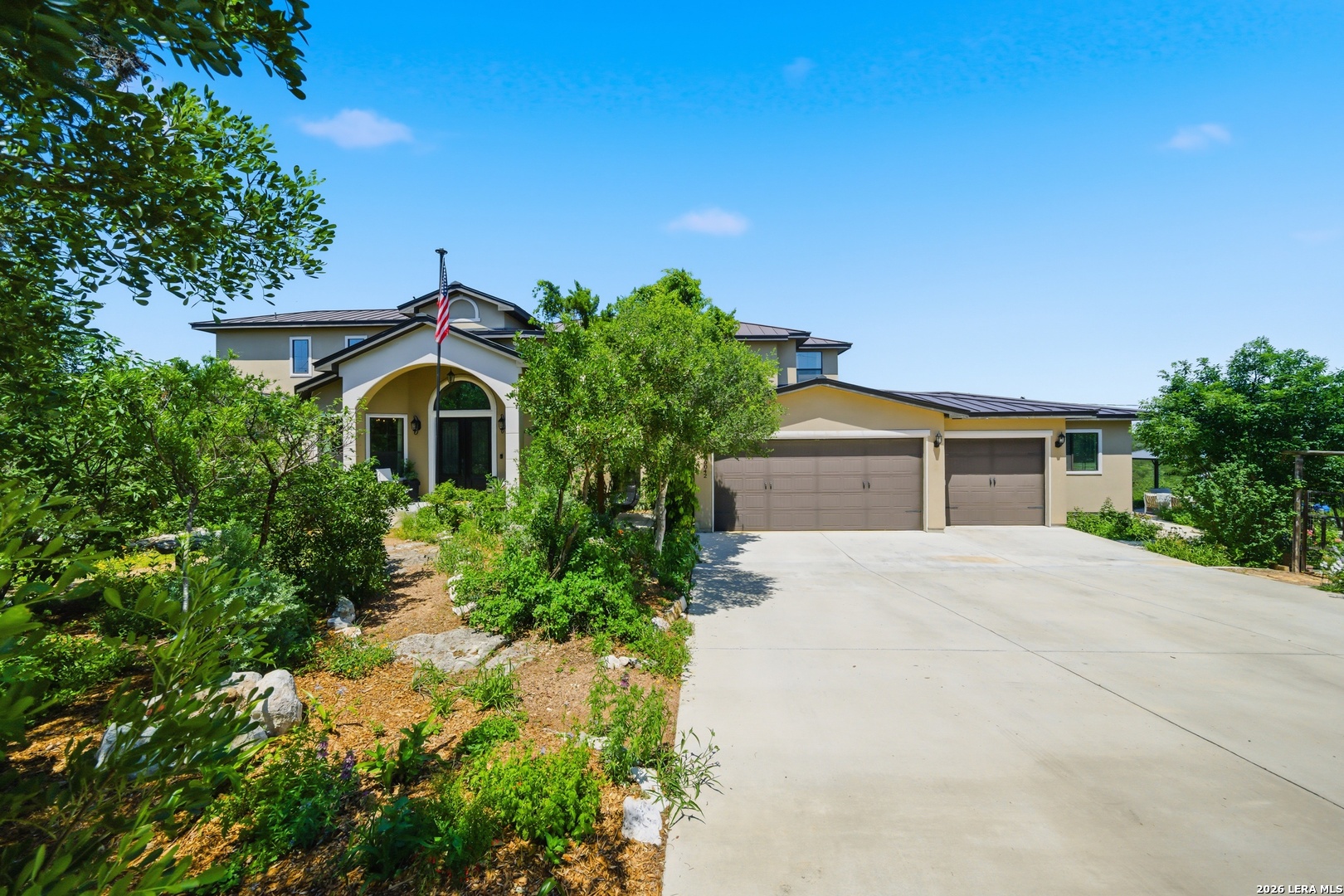 10042 Rafter S Trail Helotes, TX 78023 - Photo 4 of 69 a front view of a house with a yard and garage