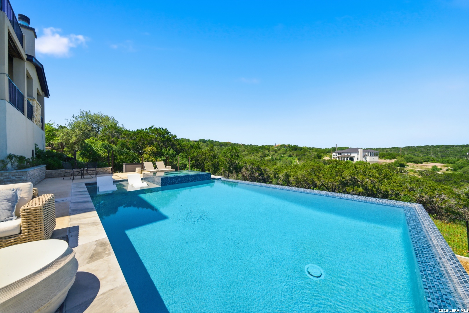 10042 Rafter S Trail Helotes, TX 78023 - Photo 48 of 69 a view of a swimming pool with a patio