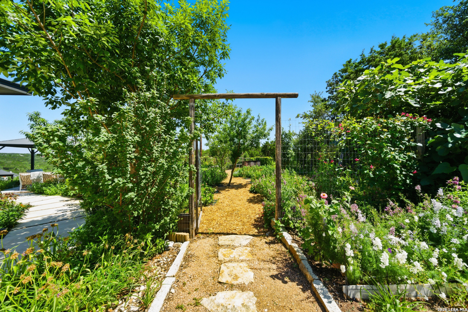 10042 Rafter S Trail Helotes, TX 78023 - Photo 51 of 69 a view of a pathway both side of yard