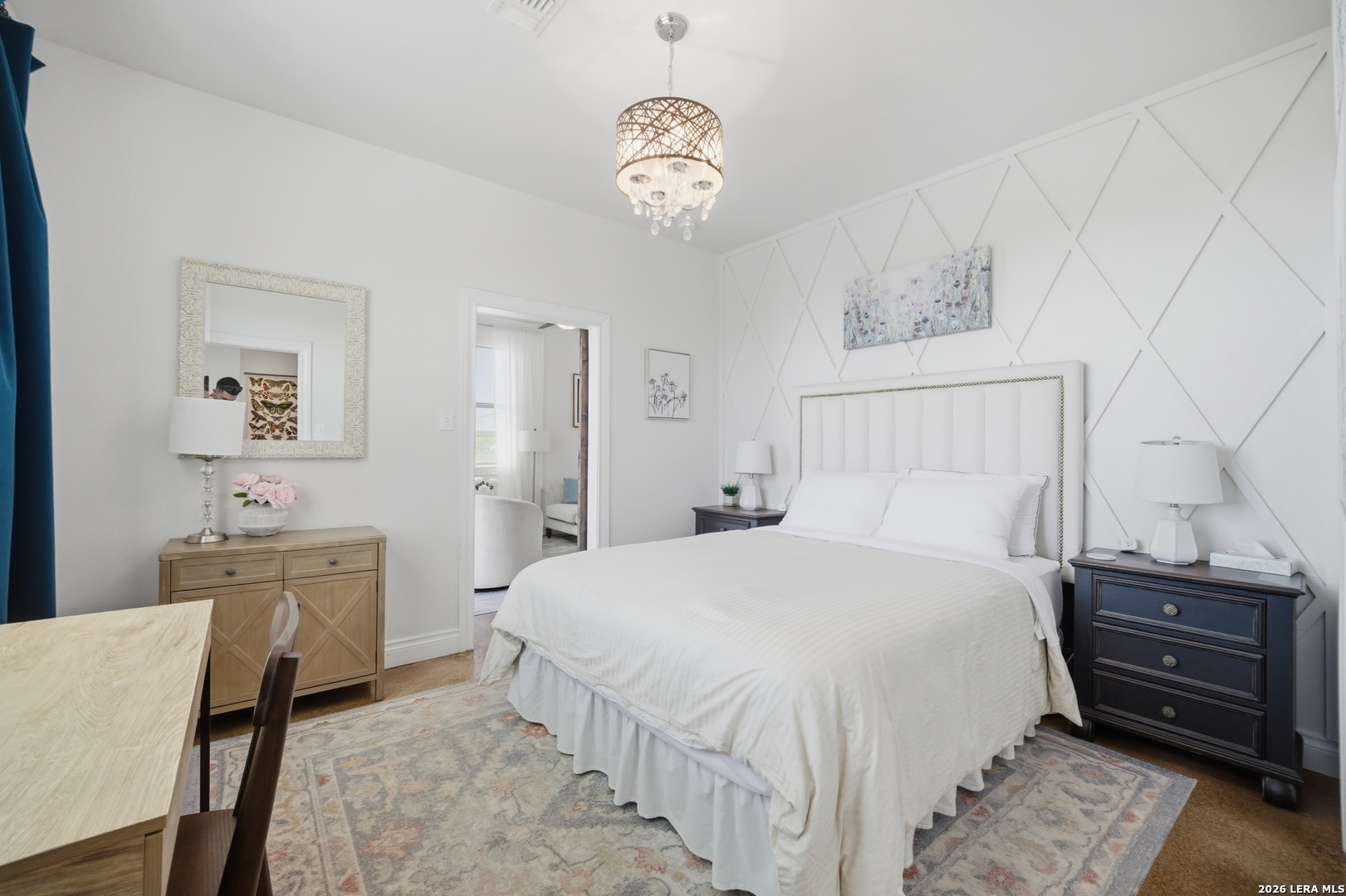 10042 Rafter S Trail Helotes, TX 78023 - Photo 63 of 69 a bedroom with a bed and a chandelier