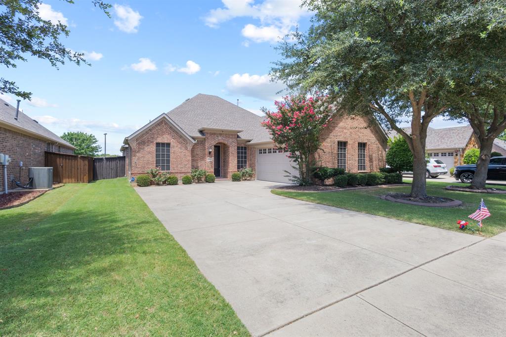 1995 Verde Court Allen, TX 75013 - Photo 27 of 30 Brick single-story residence featuring a gabled roofline and attached two-car garage