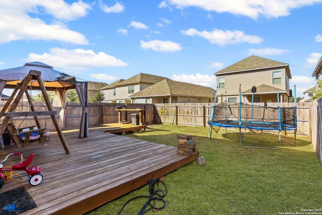 a view of a house with swimming pool and sitting area