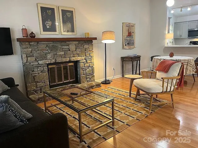 a living room with a couch and a fireplace