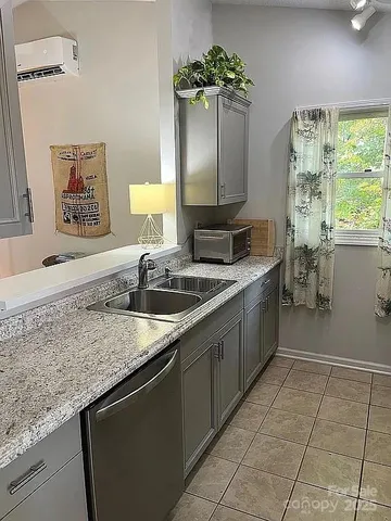 a kitchen with a sink and cabinets