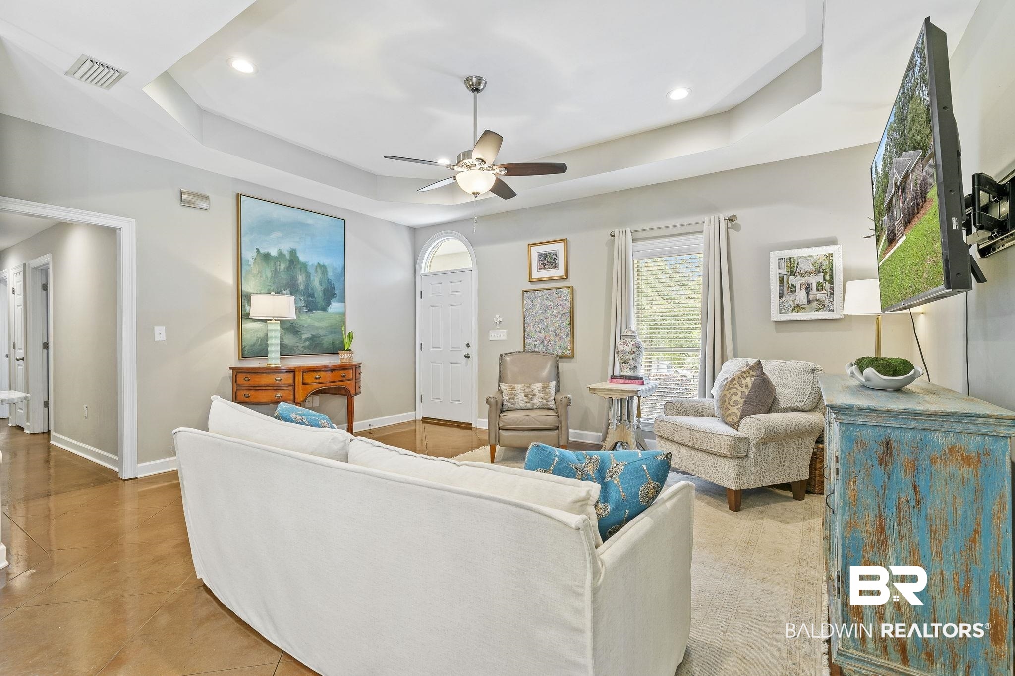 32072 Buzbee Road Daphne, AL 36527 - Photo 10 of 41 Living room with ceiling fan and a raised ceiling