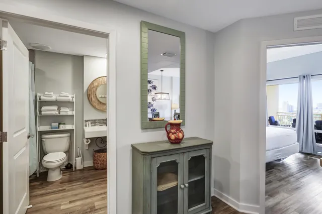a bathroom with a toilet a sink and mirror