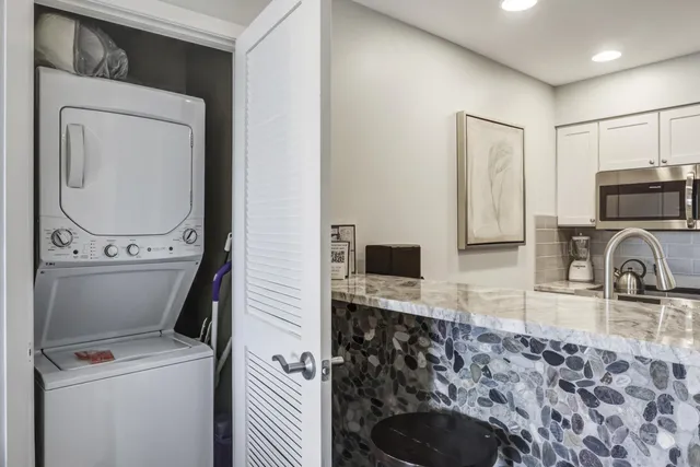 a kitchen with a refrigerator sink and stove