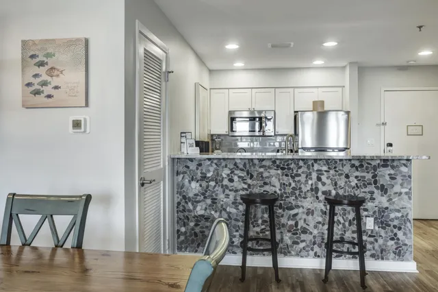 a bathroom with a sink and a refrigerator