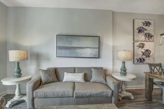 a living room with furniture and a lamp