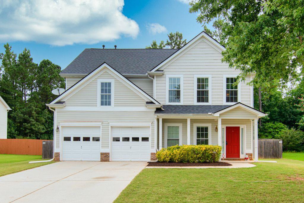 2283 Carlton Chase Road Dacula, GA 30019 - Photo 1 of 1 a view of a house with garden and yard