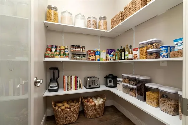 a kitchen with a lots of clutter and cabinets