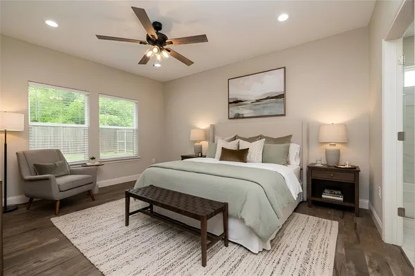 a bedroom with a bed and a couch