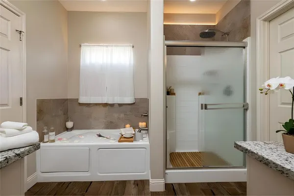 a view of bathroom with a sink and mirror