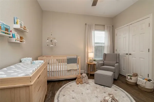 a bedroom with a bed and a couch