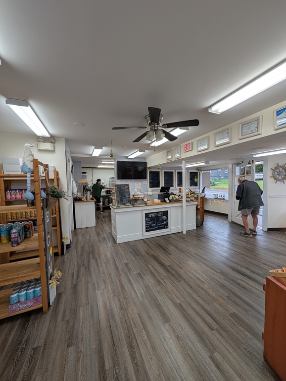 57 East Street Ipswich, MA 01938 - Photo 11 of 25 a living room with lots of furniture and kitchen view