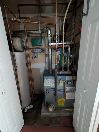 a view of storage and utility room with racks on the wall