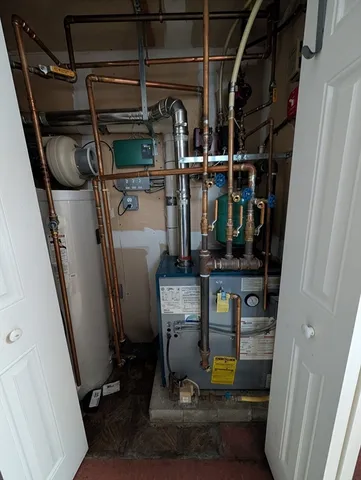 a view of storage and utility room with racks on the wall
