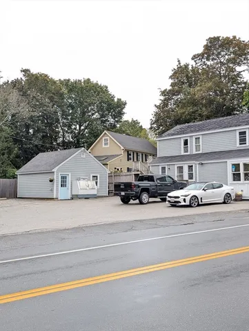 a view of multiple houses with a road