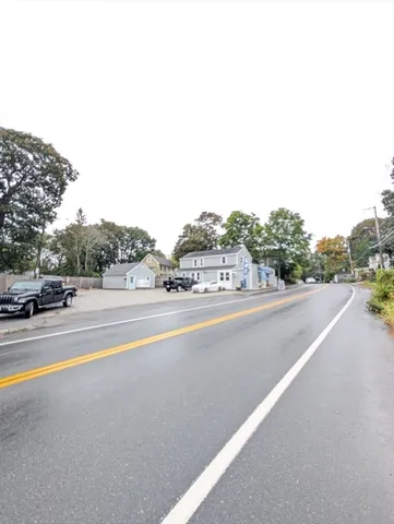 a view of street with a house