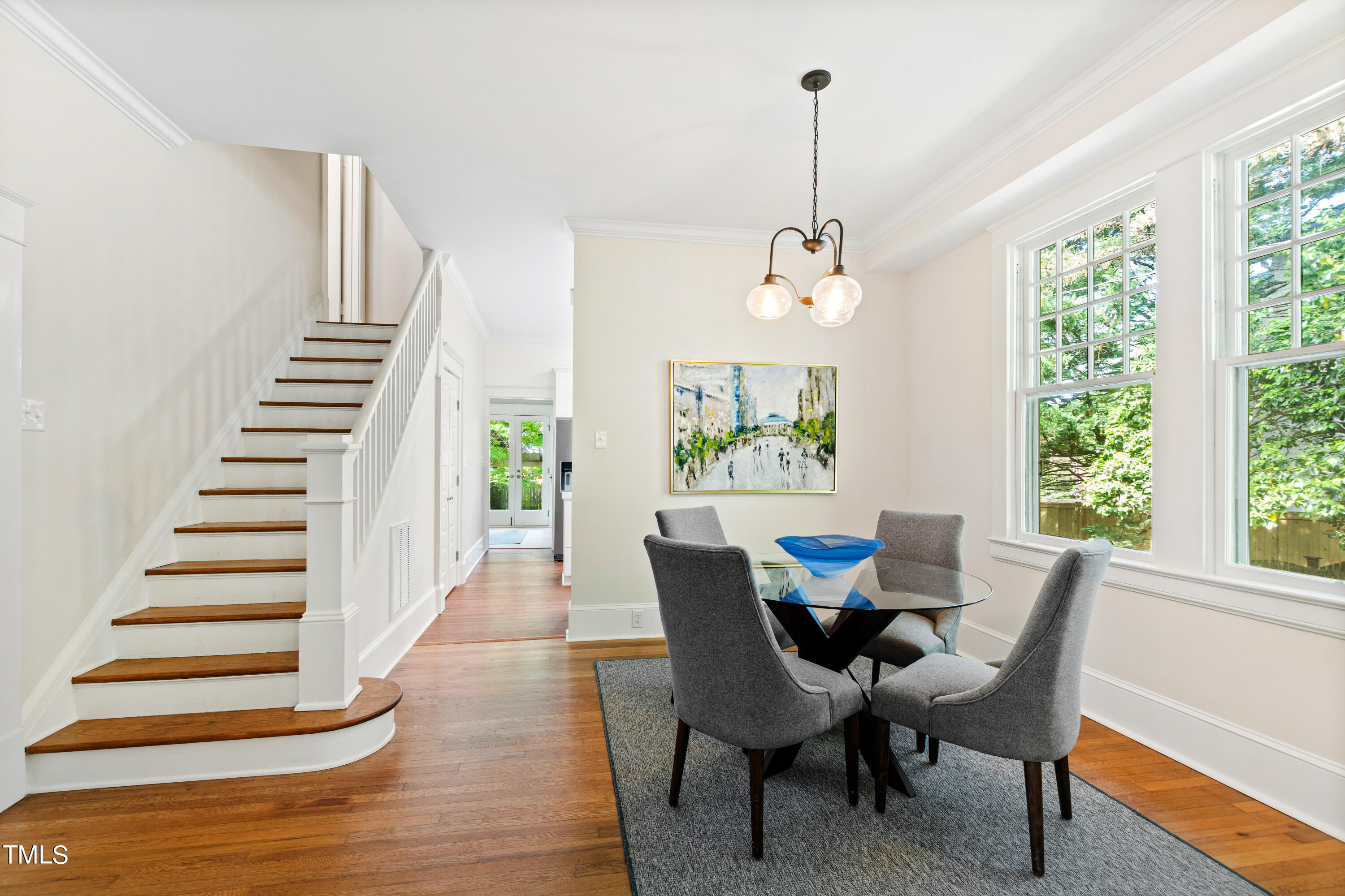 1803 Fairview Road Raleigh, NC 27608 - Photo 11 of 49 a view of a dining room with furniture window and wooden floor