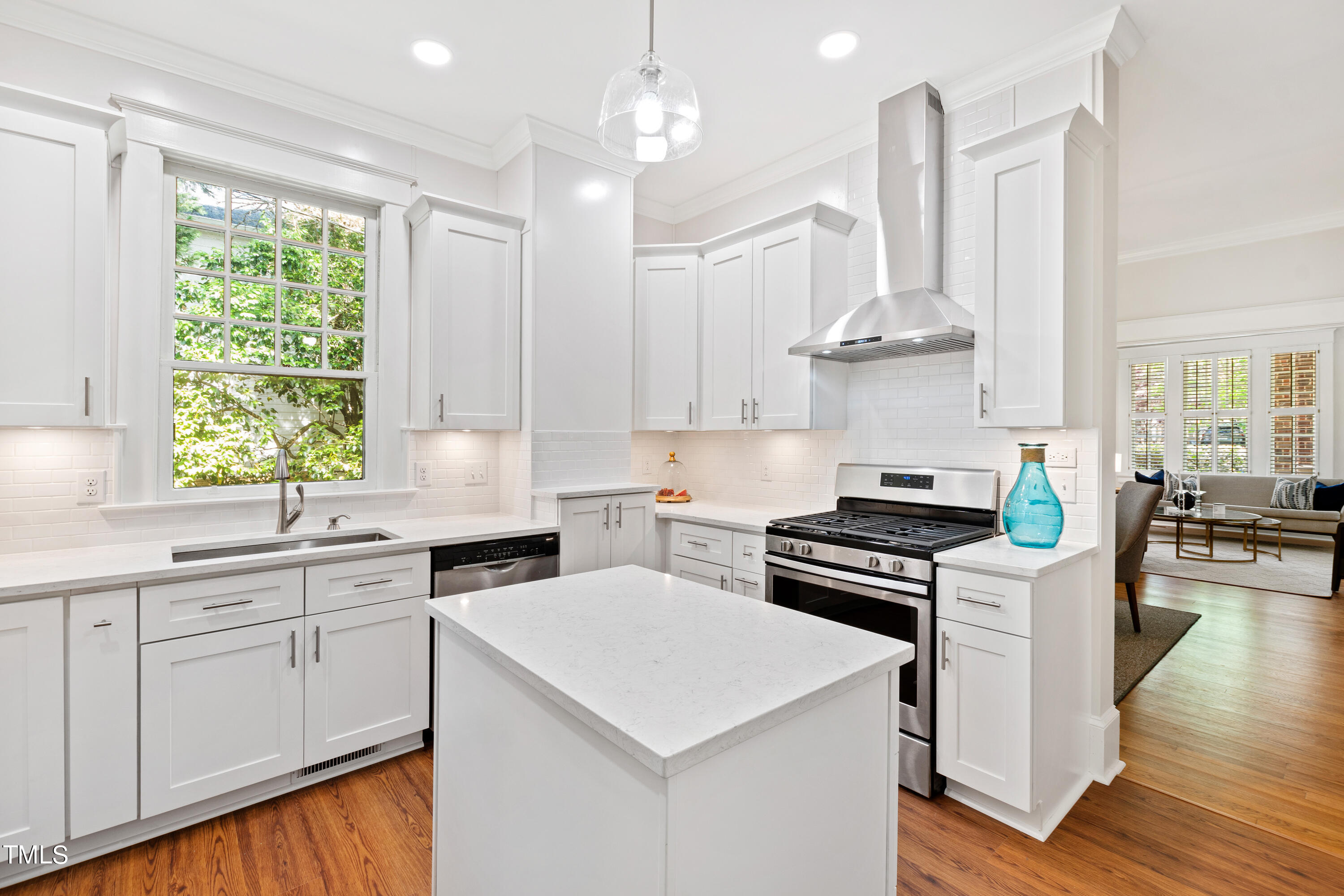 1803 Fairview Road Raleigh, NC 27608 - Photo 12 of 49 a kitchen with stainless steel appliances a stove a sink and cabinets