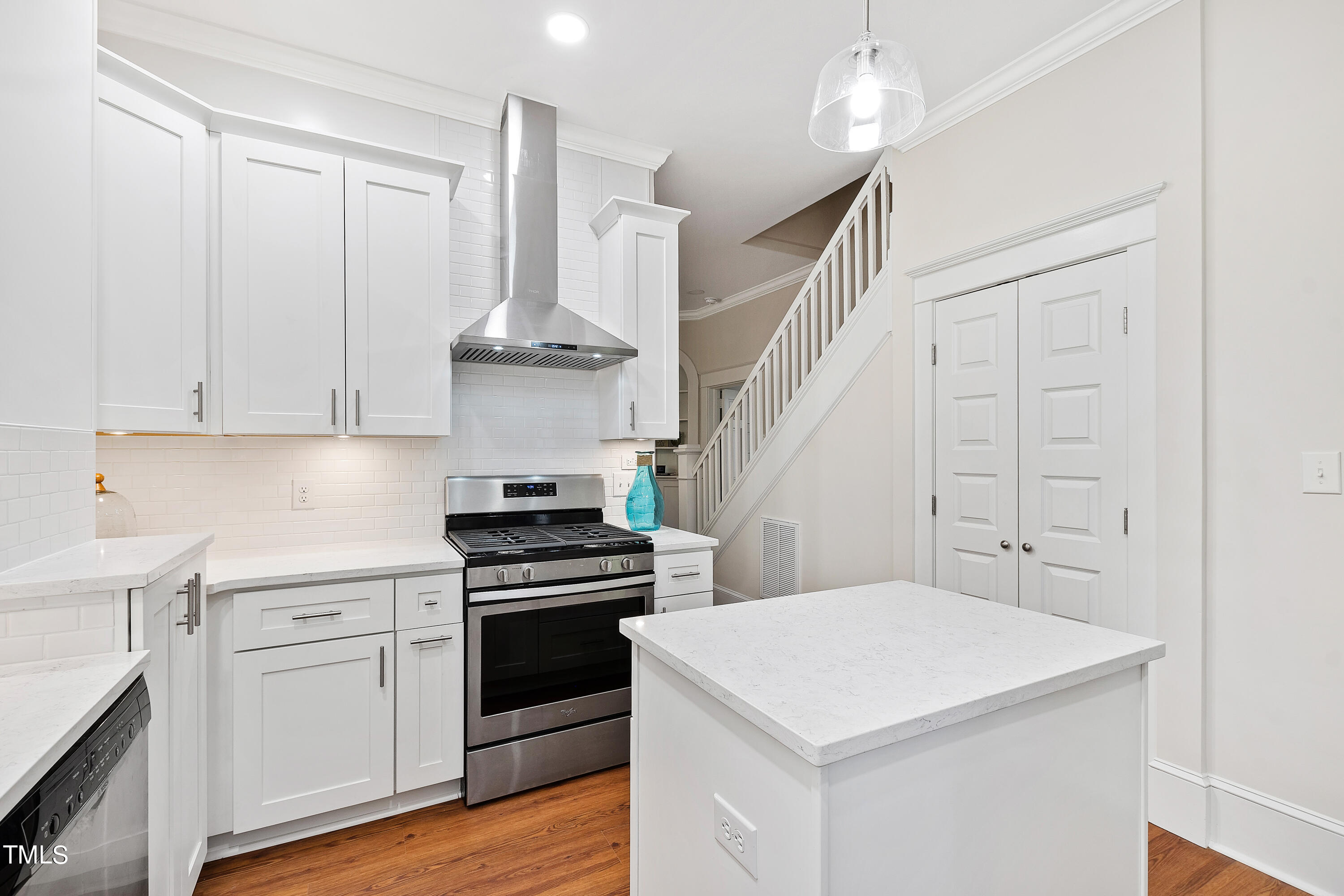 1803 Fairview Road Raleigh, NC 27608 - Photo 13 of 49 a kitchen with cabinets and stainless steel appliances