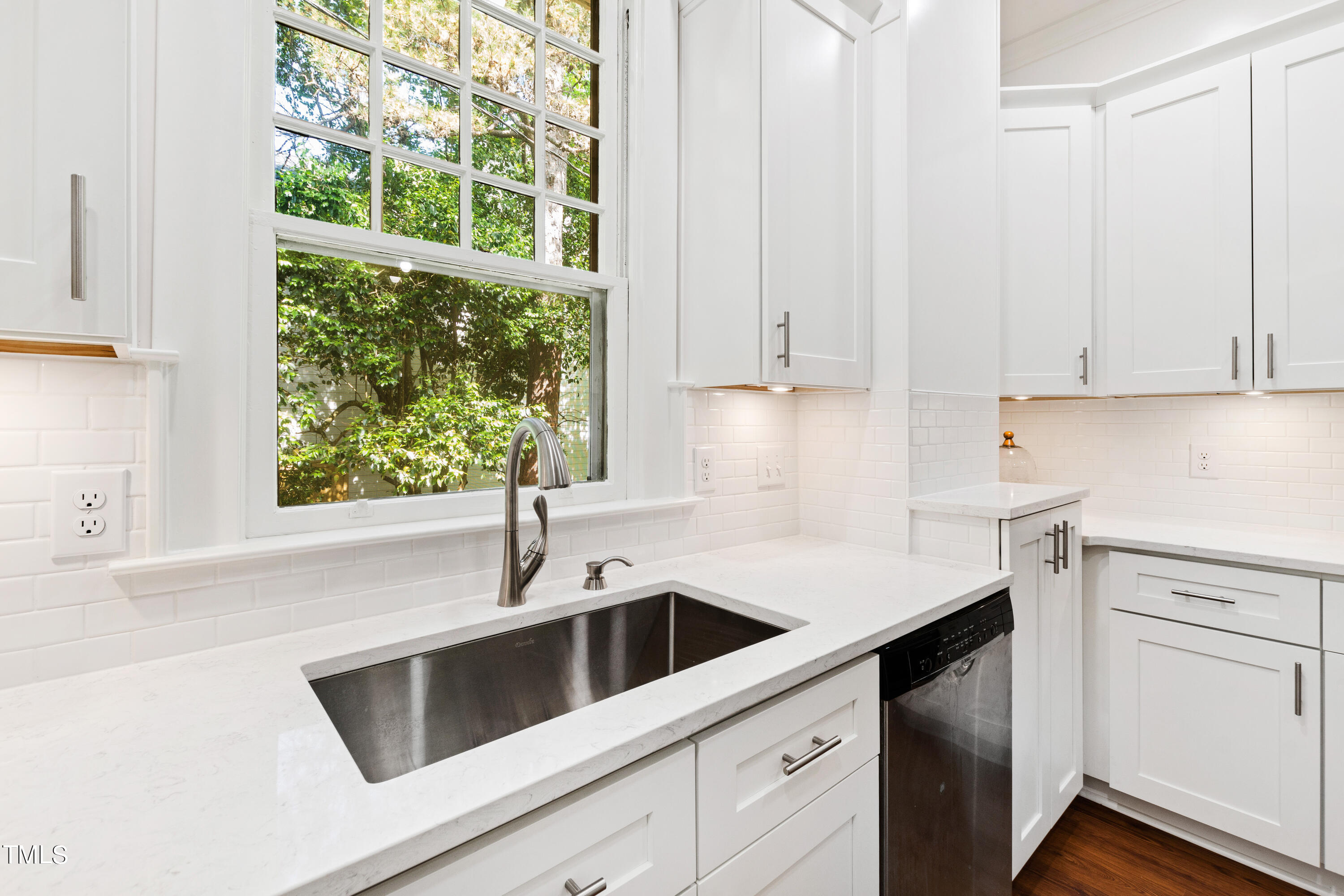 1803 Fairview Road Raleigh, NC 27608 - Photo 14 of 49 a kitchen with a sink and cabinets