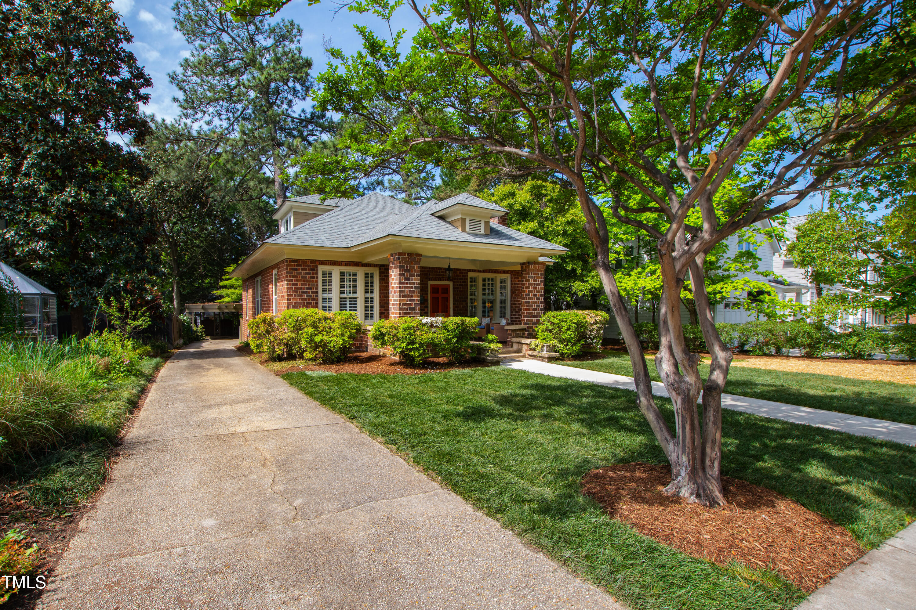 1803 Fairview Road Raleigh, NC 27608 - Photo 2 of 49 a front view of a house with garden