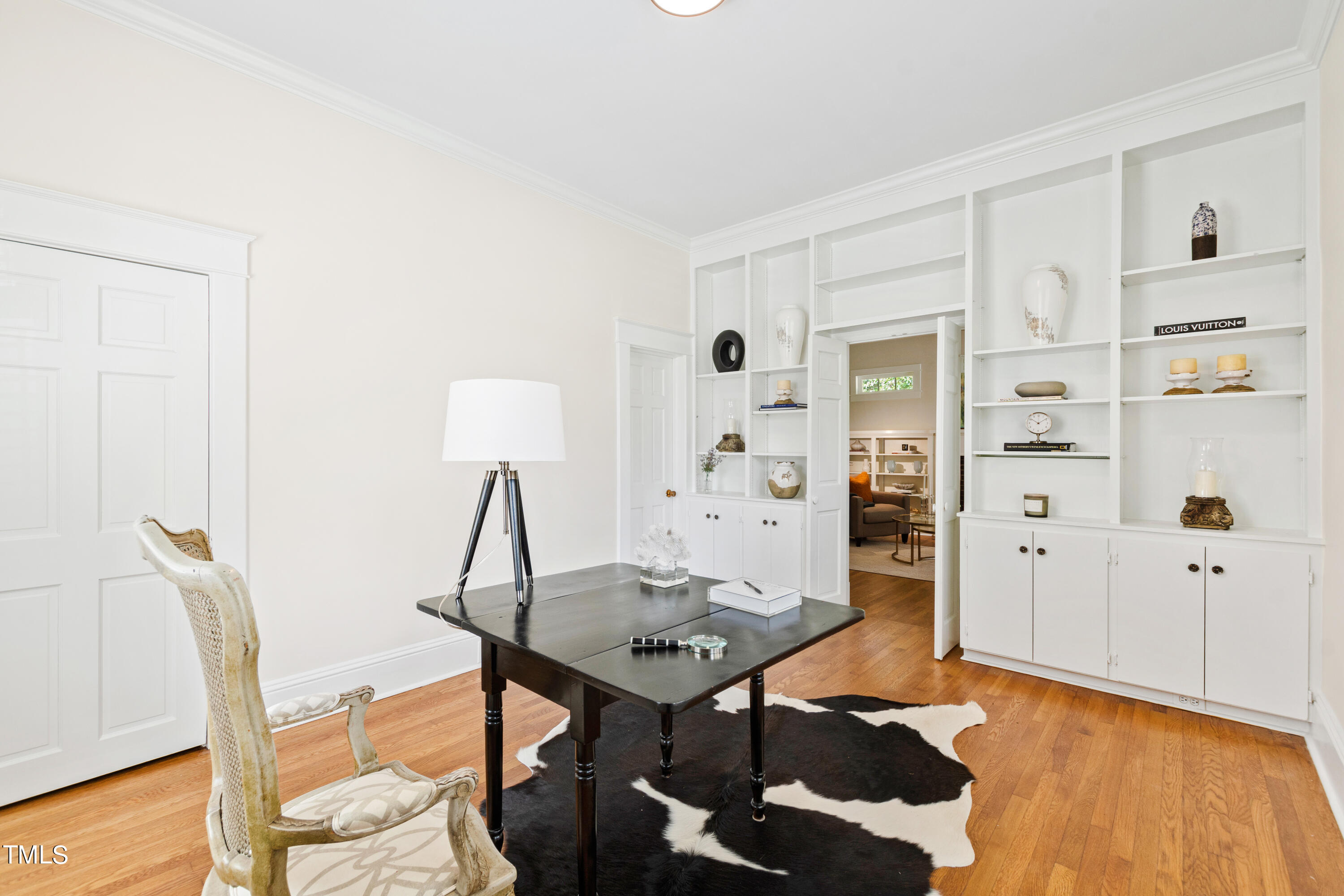 1803 Fairview Road Raleigh, NC 27608 - Photo 21 of 49 a view of a workspace with furniture and wooden floor