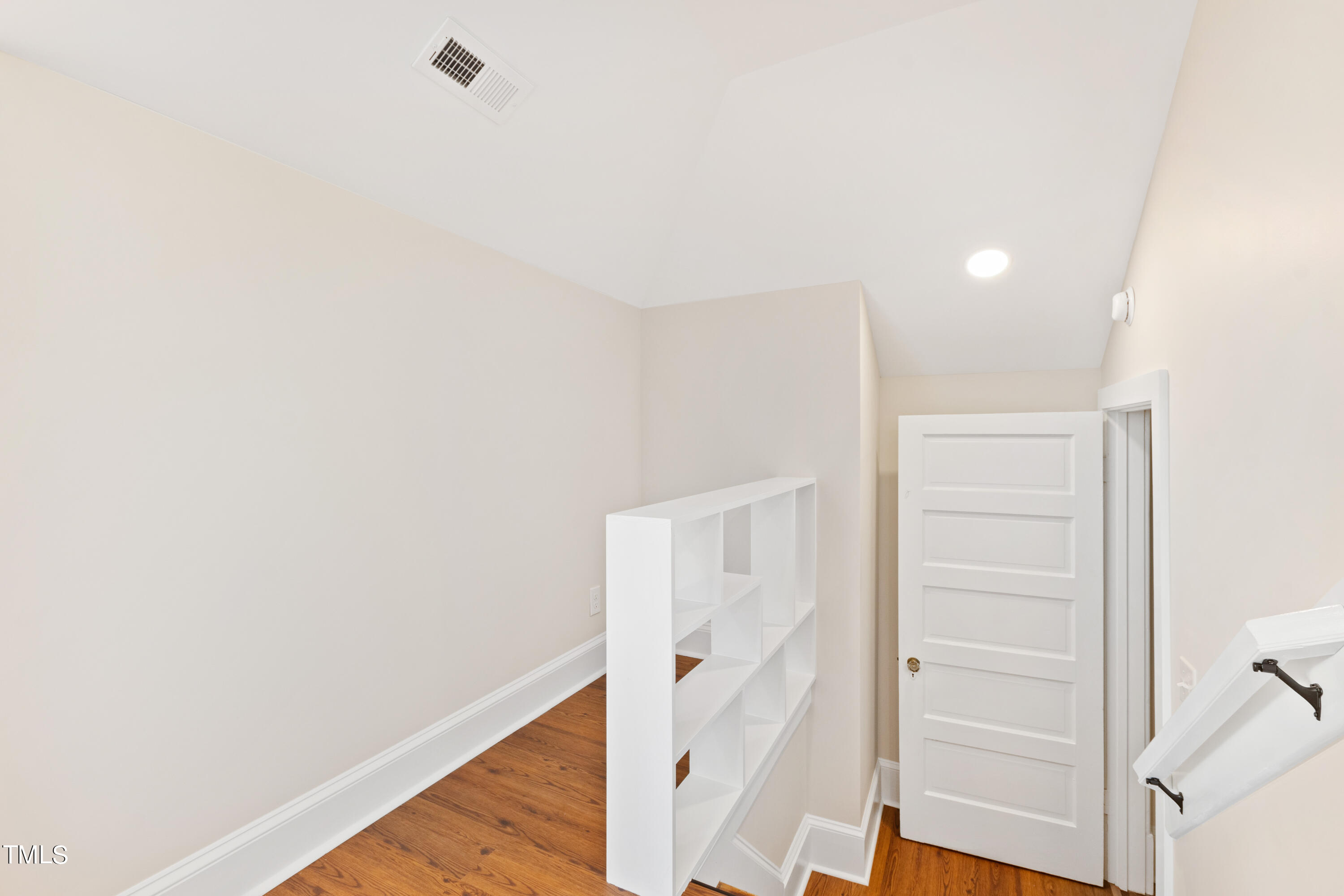 1803 Fairview Road Raleigh, NC 27608 - Photo 29 of 49 a view of walk in closet with empty racks