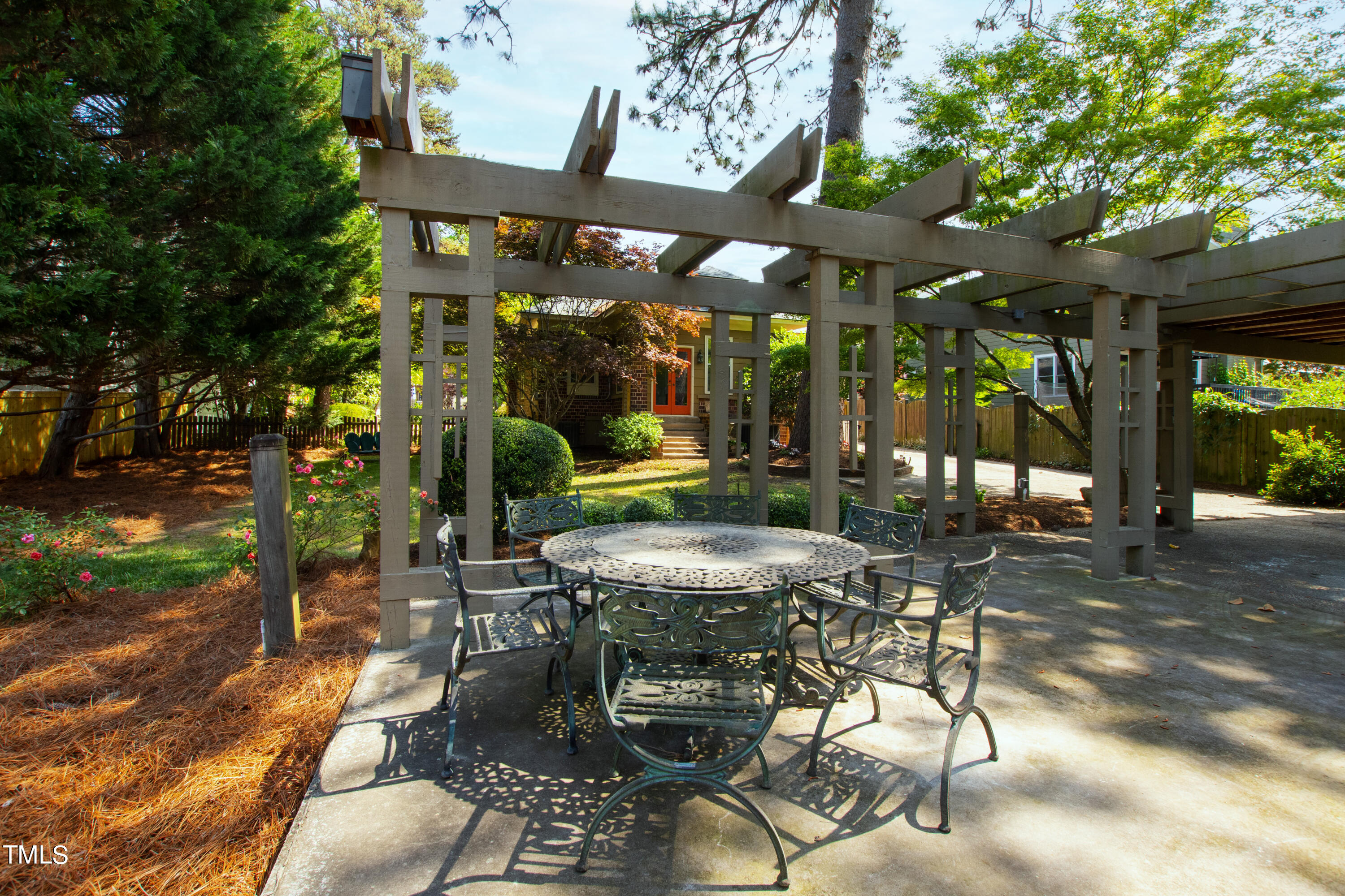 1803 Fairview Road Raleigh, NC 27608 - Photo 42 of 49 a view of a patio with a table chairs and a backyard