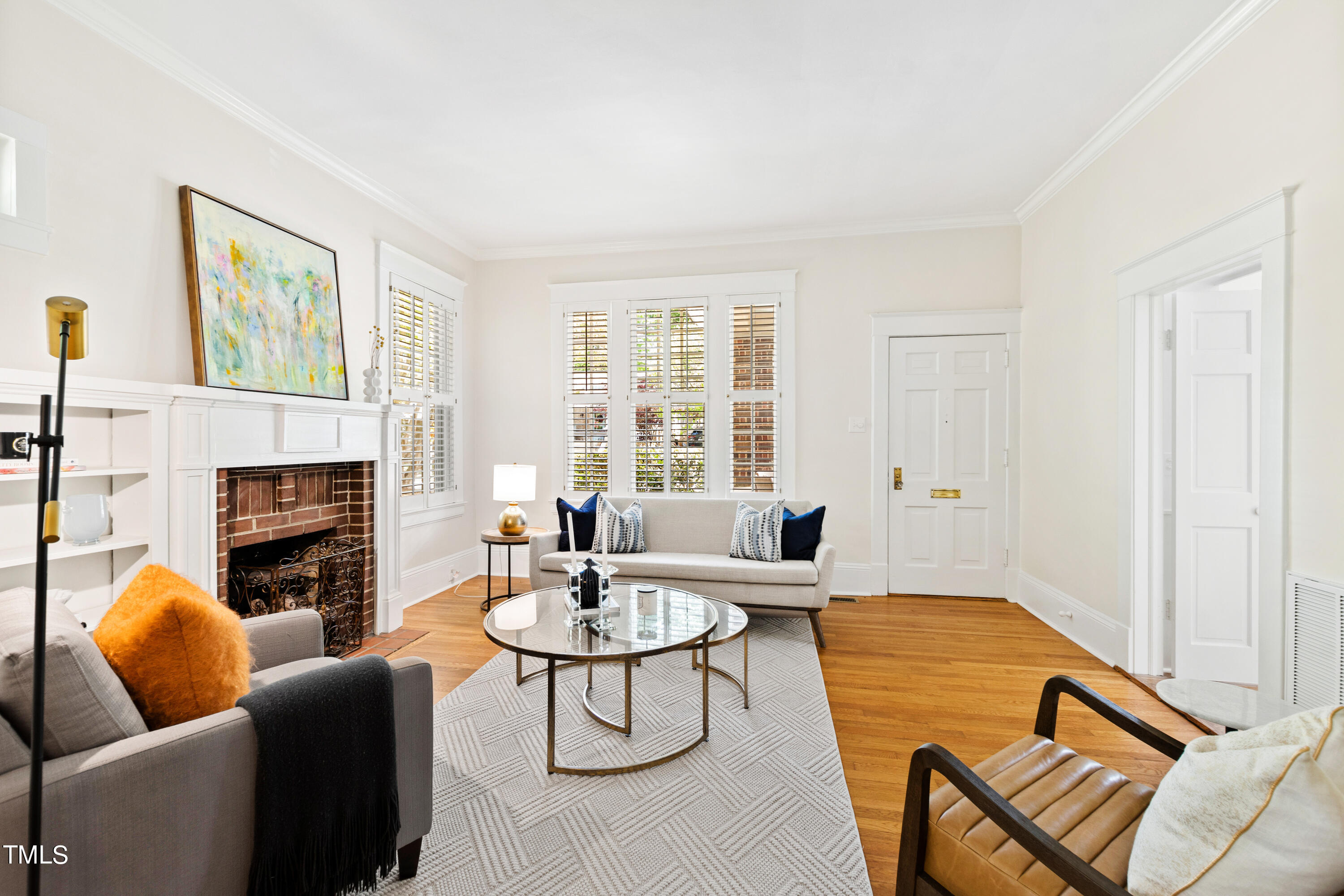1803 Fairview Road Raleigh, NC 27608 - Photo 6 of 49 a living room with furniture a fireplace and a table