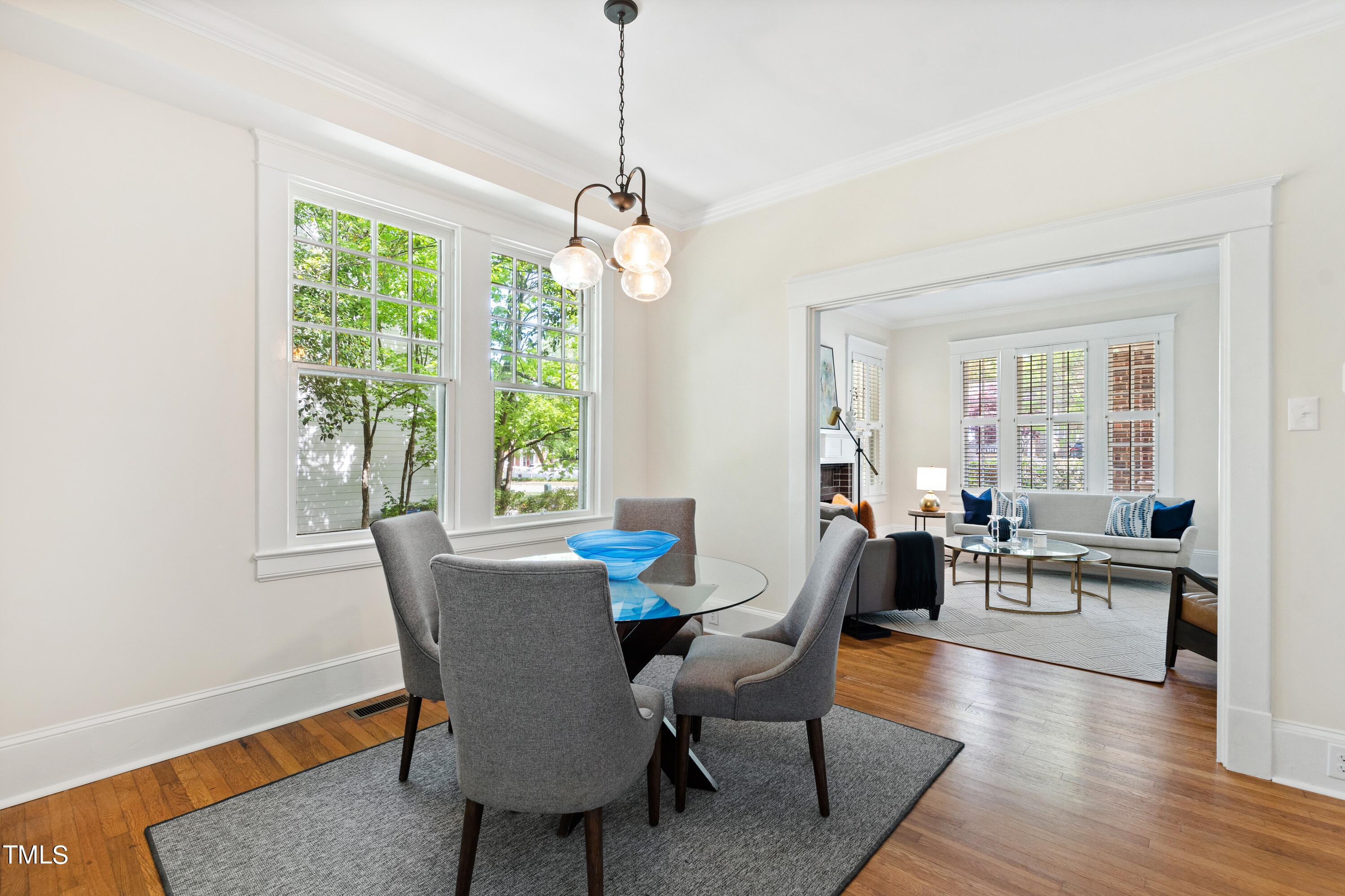 1803 Fairview Road Raleigh, NC 27608 - Photo 10 of 49 a view of a dining room with furniture window and wooden floor
