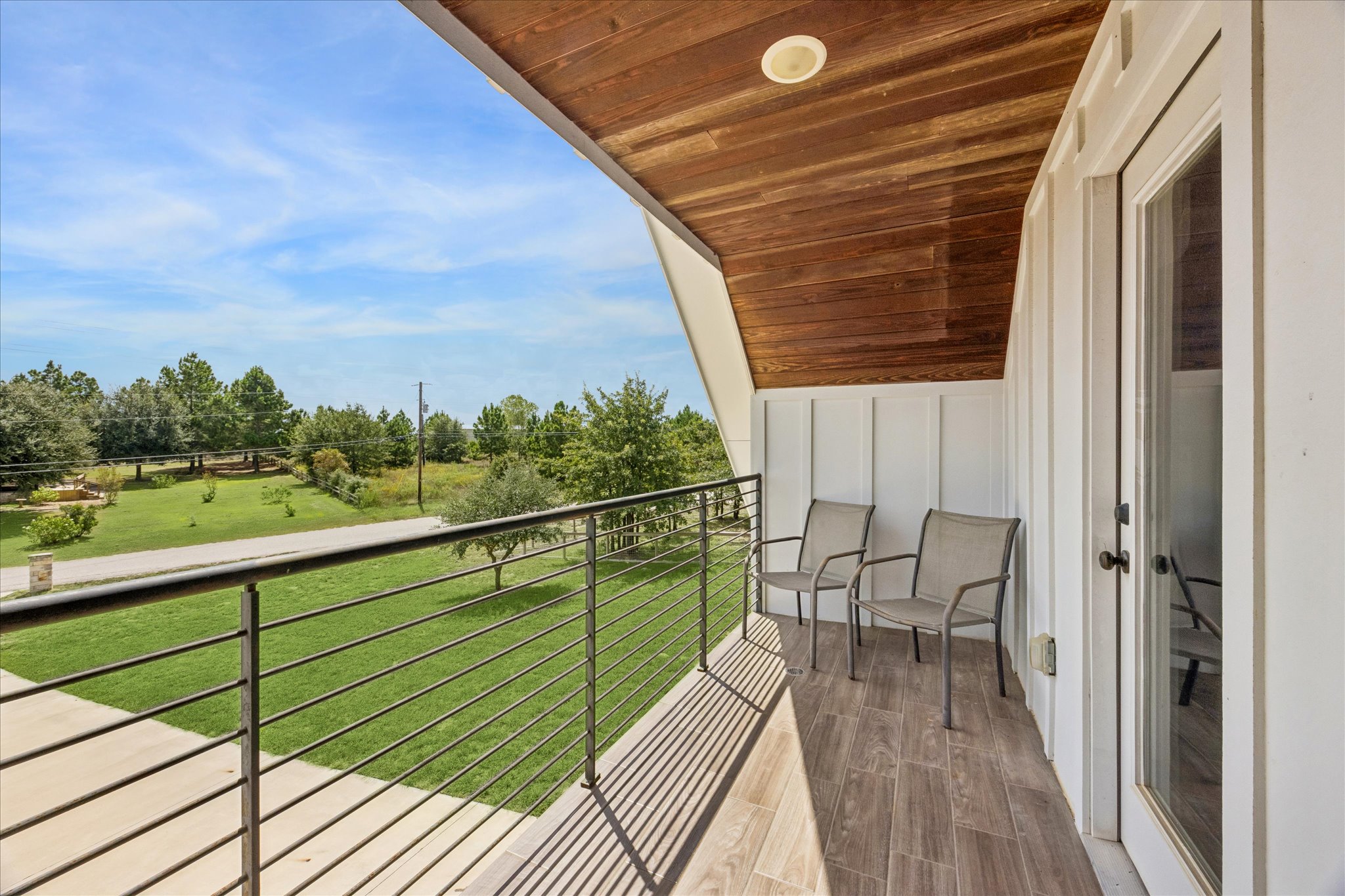 116 Mallard Road Bastrop, TX 78602 - Photo 25 of 31 Rich wood plank ceilings and modern tiled floors define this elevated outdoor retreat.