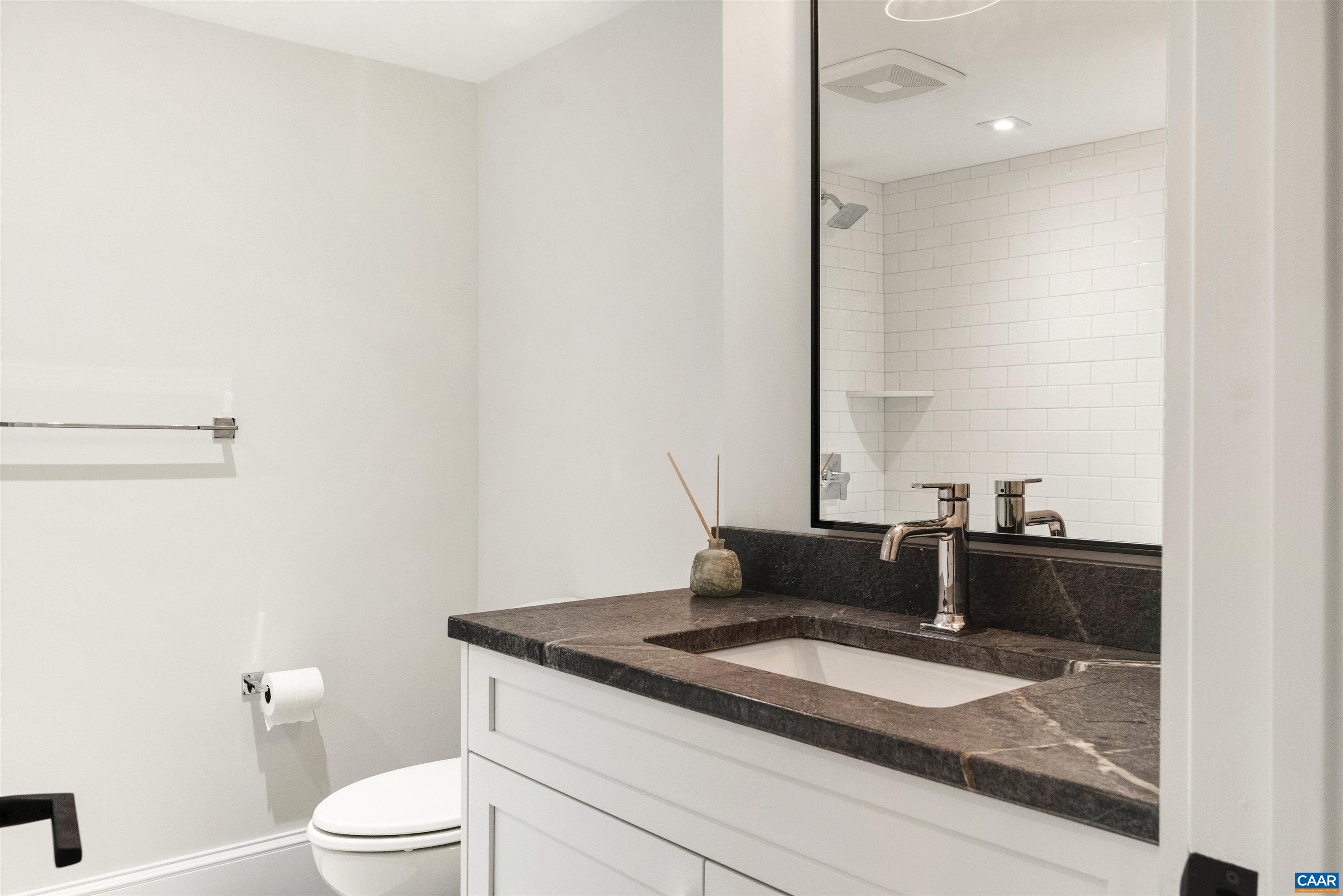 1824 Winston Road Charlottesville, VA 22903 - Photo 34 of 46 a bathroom with a granite countertop sink and a mirror
