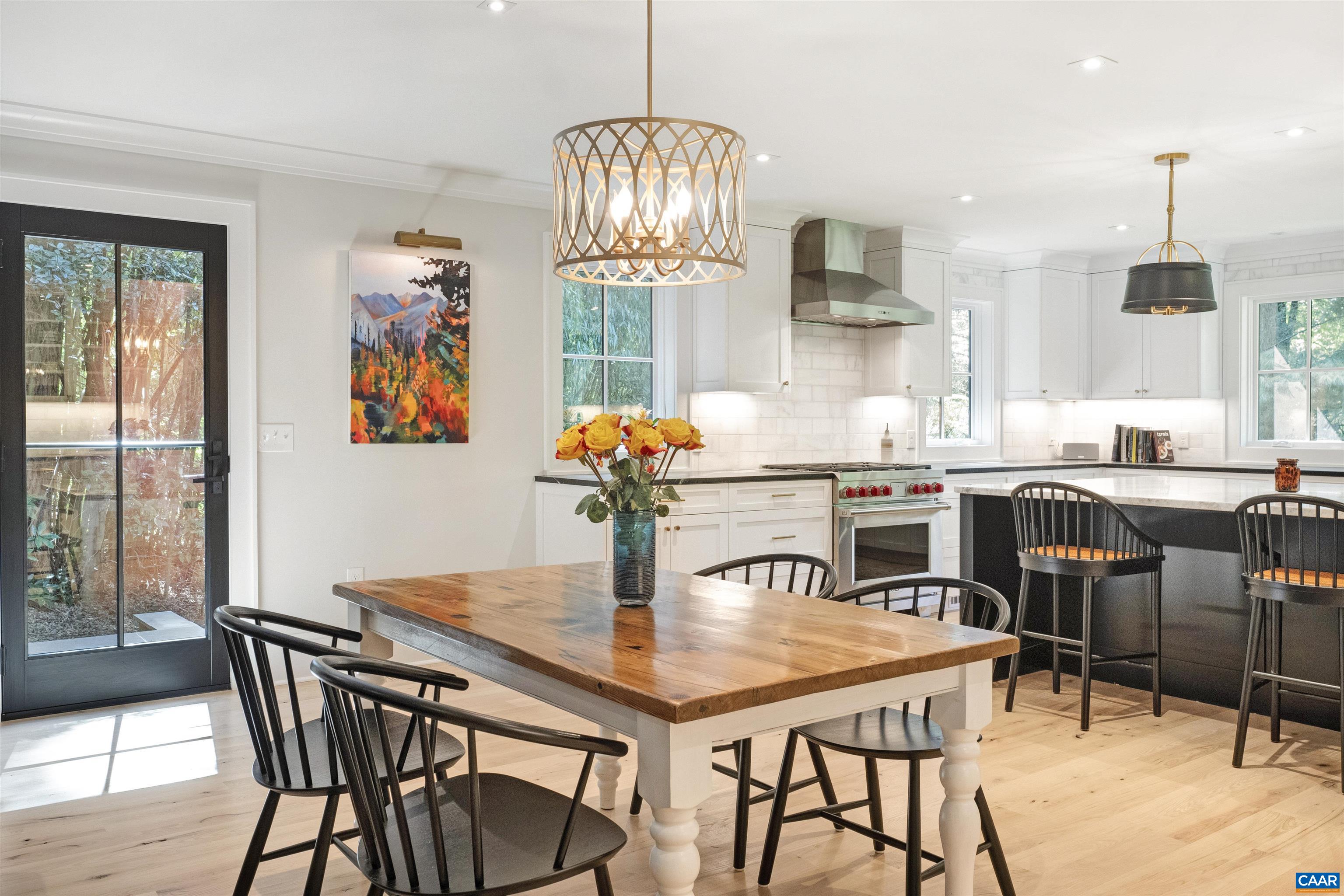 1824 Winston Road Charlottesville, VA 22903 - Photo 8 of 46 a dining room with furniture a chandelier and wooden floor