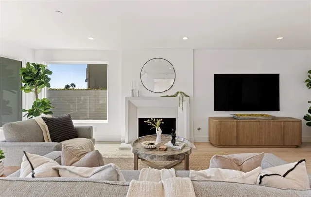 a spacious en suite bathroom with double vanity and mirrors