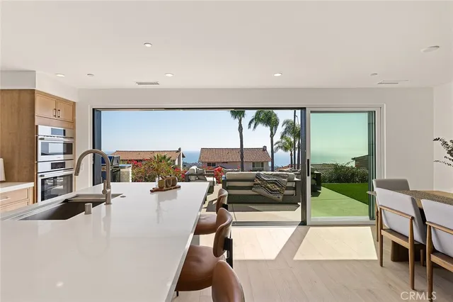 a kitchen with a sink and a stove top oven