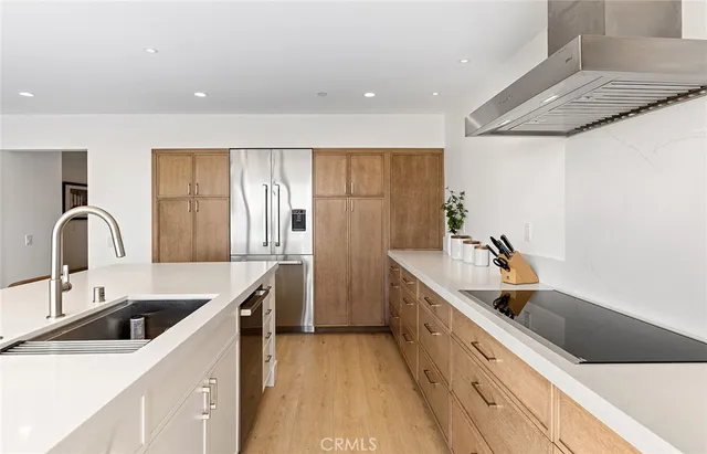 a living room with kitchen island furniture and a flat screen tv
