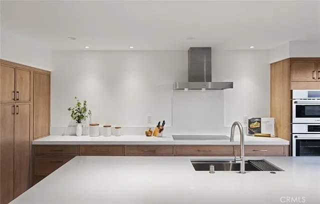 a view of hallway with furniture and a potted plant