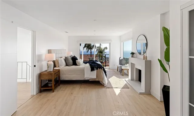 a bedroom with a bed and a potted plant