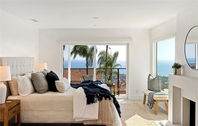 a bathroom with a tub a sink and mirror