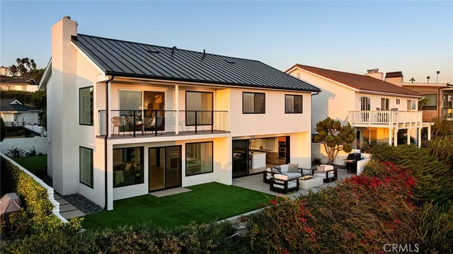 a terrace of a house with outdoor seating