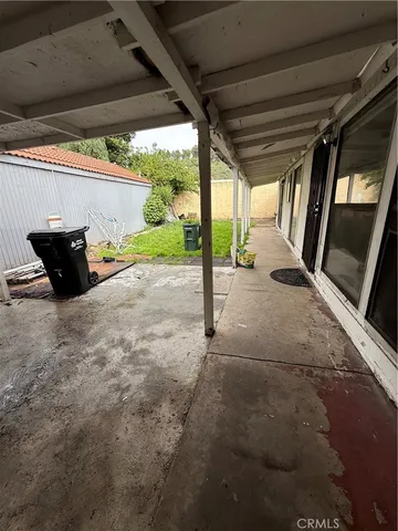 a view of a room with table and chairs