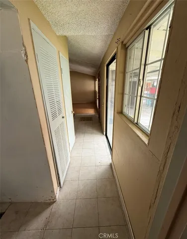 a view of entryway with stairs and a window