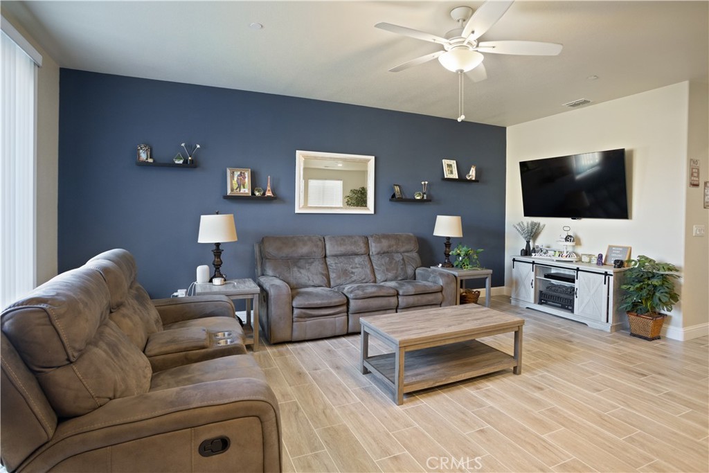 4440 Lindsey Lane Merced, CA 95348 - Photo 11 of 23 a living room with furniture and a flat screen tv