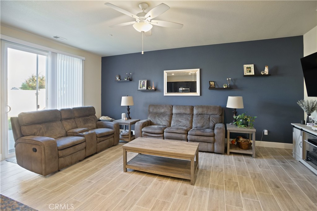 4440 Lindsey Lane Merced, CA 95348 - Photo 12 of 23 a living room with furniture and wooden floor